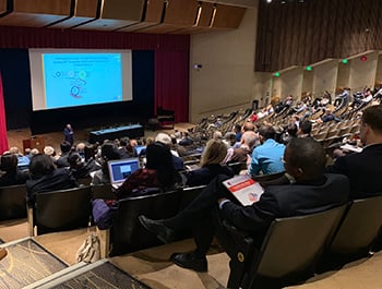 An audience seated in the Turner Auditorium.