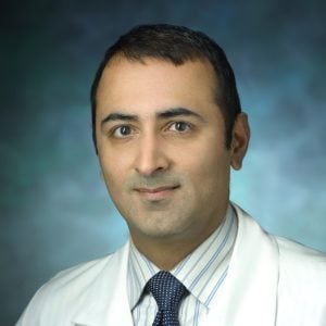 Headshot of Haris Sair wearing a Johns Hopkins Medicine doctor's coat.