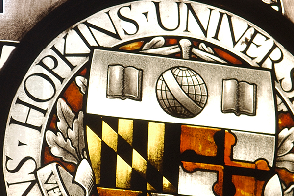A close-up of the Johns Hopkins University seal.