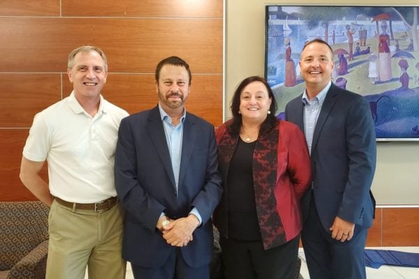 Nursing Dean Patricia Davidson, Engineering Dean Ed Schlesinger, Malone Center Director Gregory Hager, and PhD program director Jason Farley pose for a picture.