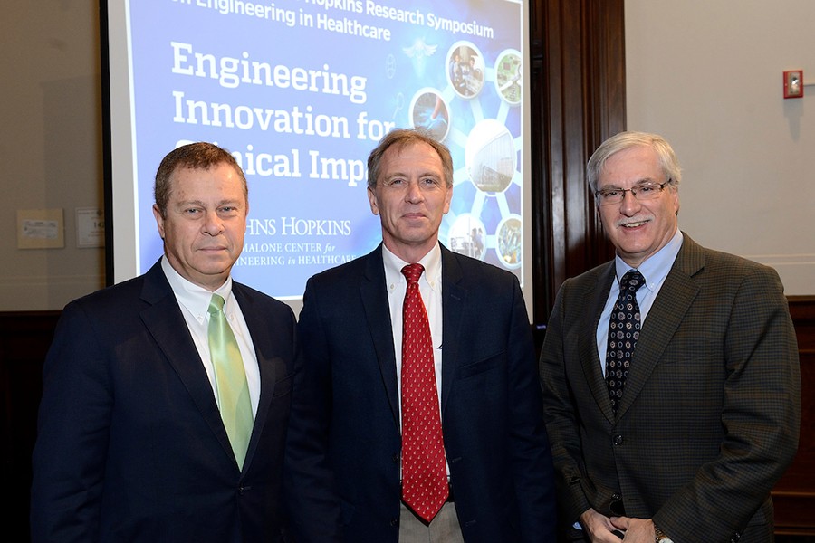 Ed Schlesinger, Greg Hager, and a third leadership member pose together at the Inaugural Johns Hopkins Research Symposium on Engineering in Healthcare.