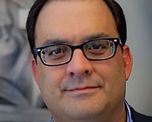 Headshot of John Toscano.