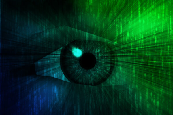 A graphic of an eye overlaid with green and blue Matrix code.