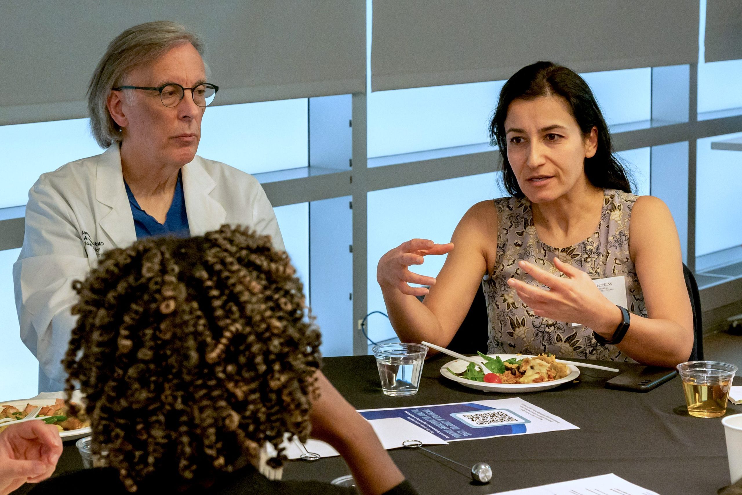 Kimia Ghobadi and other researchers discuss at lunch at the 2023 Johns Hopkins Research Symposium on Engineering in Healthcare.