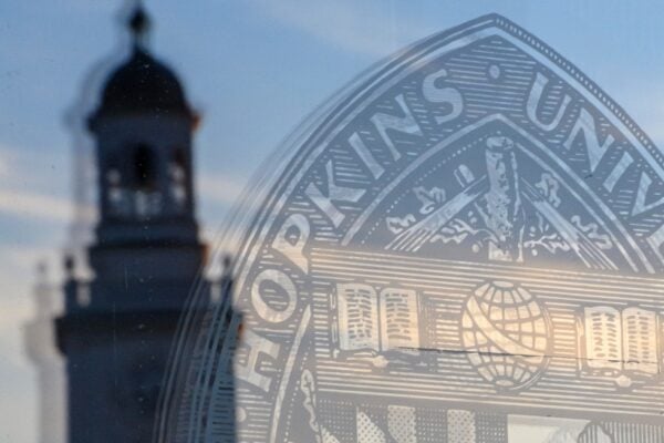 Reflection of the Gilman tower in MSE Library Q-Level door.